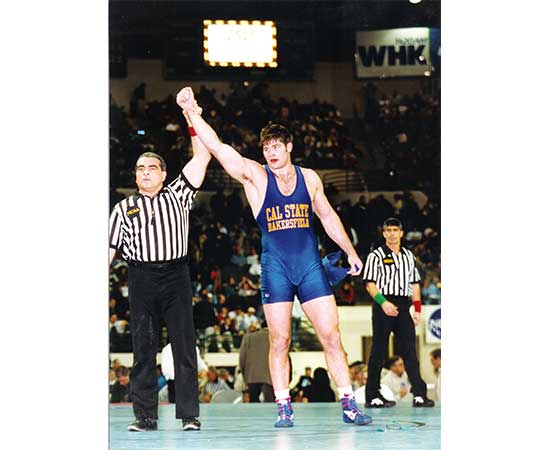 1997: Senior Stephen Neal finishes wrestling season