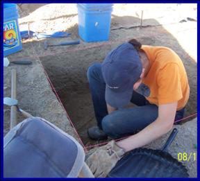 Photograph of student digging.