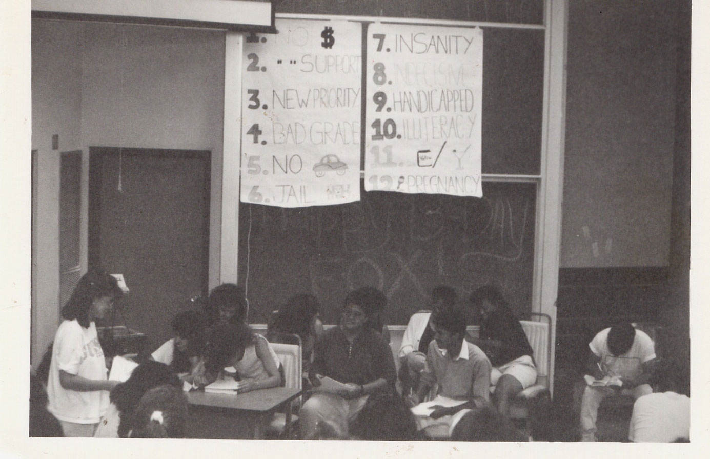 A black and white photo of a 1989 Summer Bridge class discussing college challenges