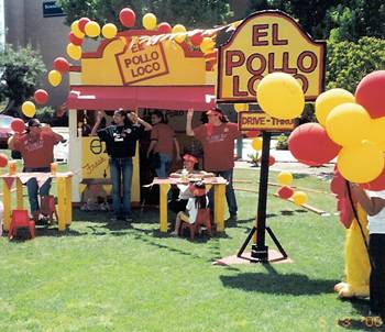 Theta Sigma Chi in the El Pollo Loco house on the lawn