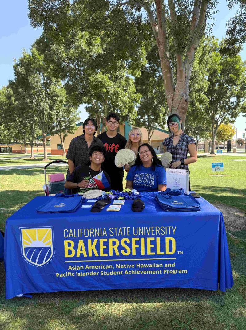 Students from Filipino American Student Organization, Kaibigan, with AANHPI Assistant, Marrian Angeles. Taking a photo at 60th Anniversary Bold Step Event at Robert F. Kennedy High School.