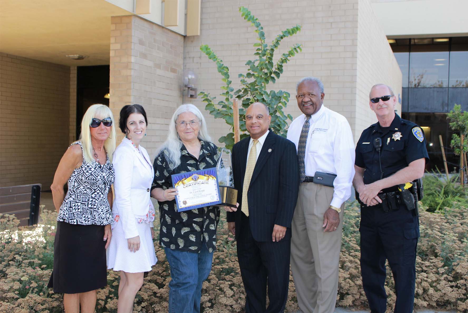 Dr. Carol Raupp recieveing Most Beautiful Area on Campus award