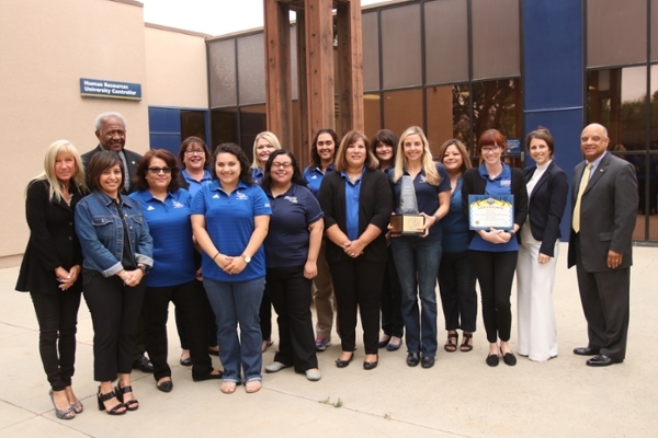 Human Resources & Payroll Services recieveing Most Beautiful Area on Campus award