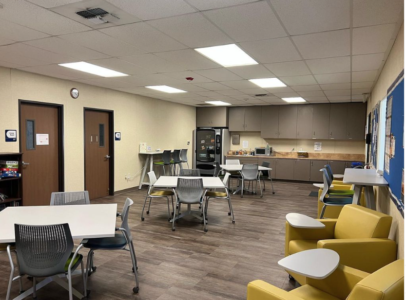 People sitting at a table in CSUB's student lounge