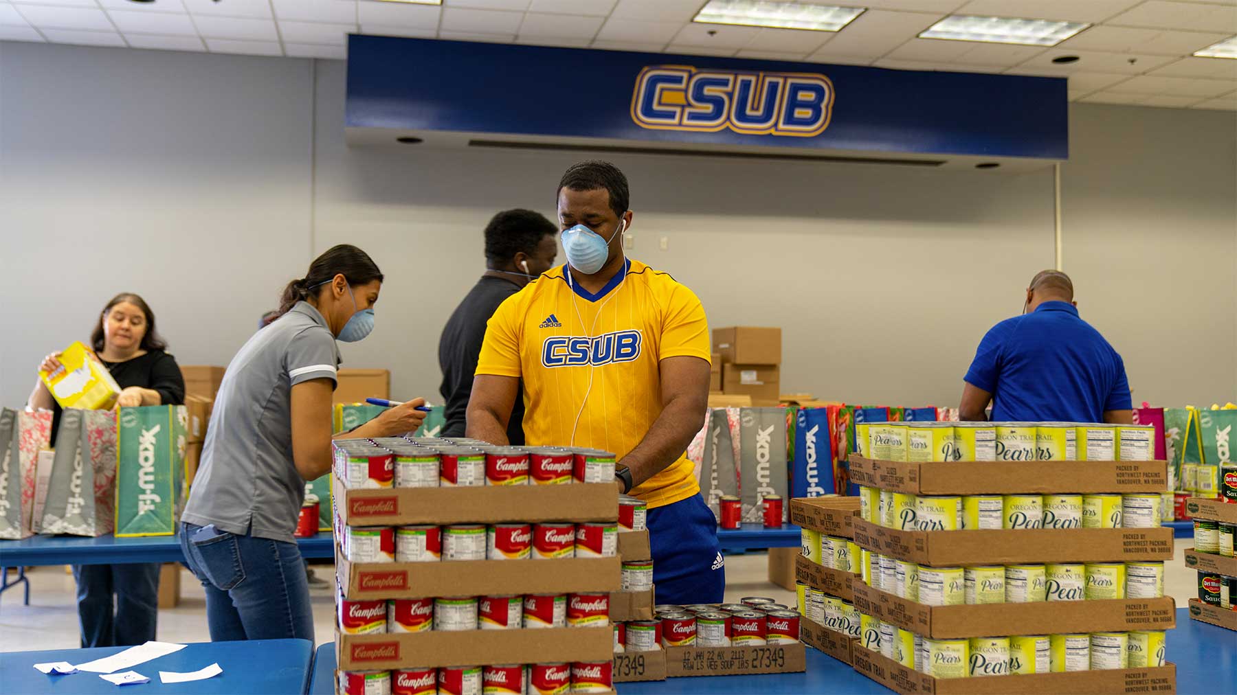 People sorting cans at the food pantry