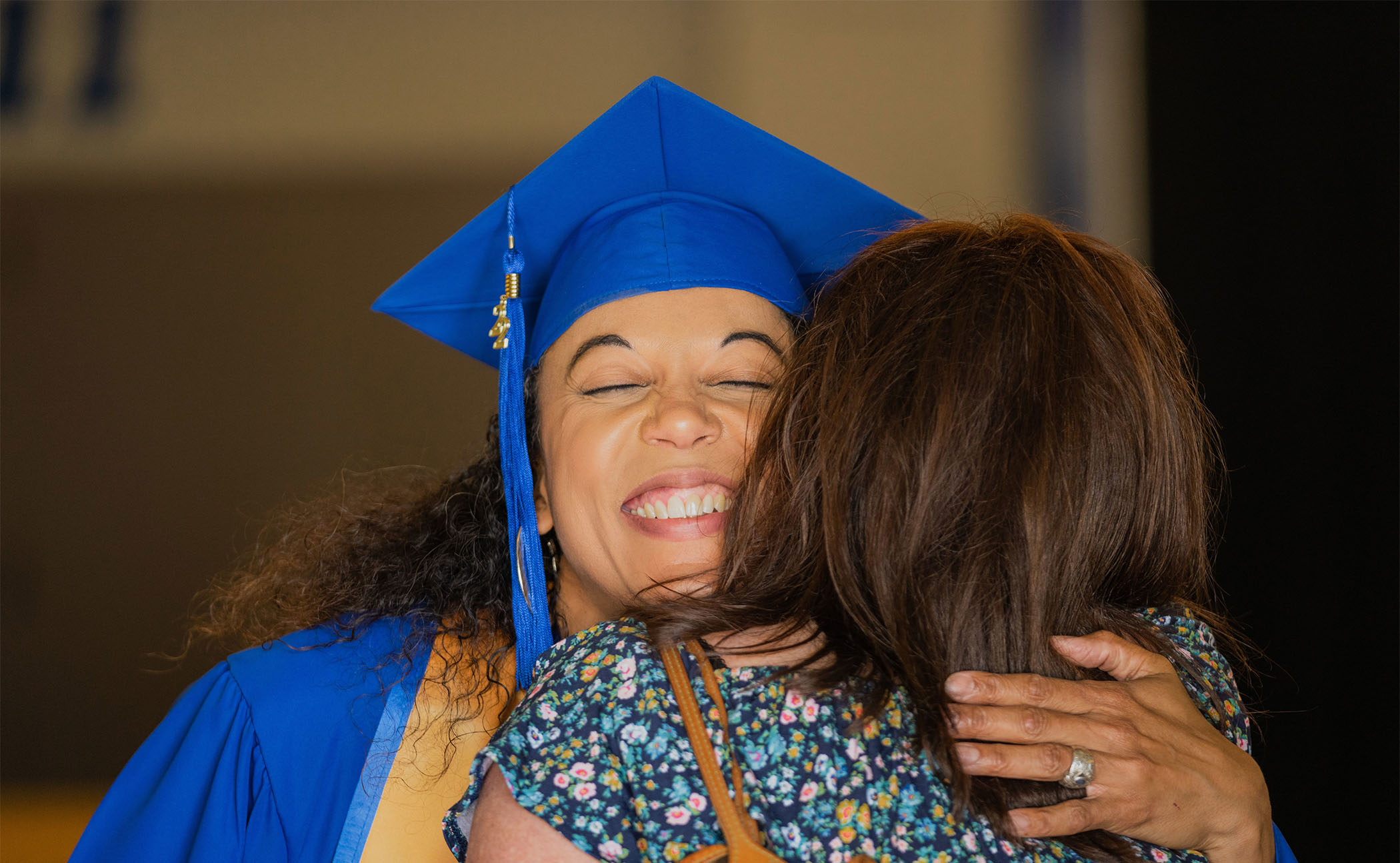 Graduate embraces family member