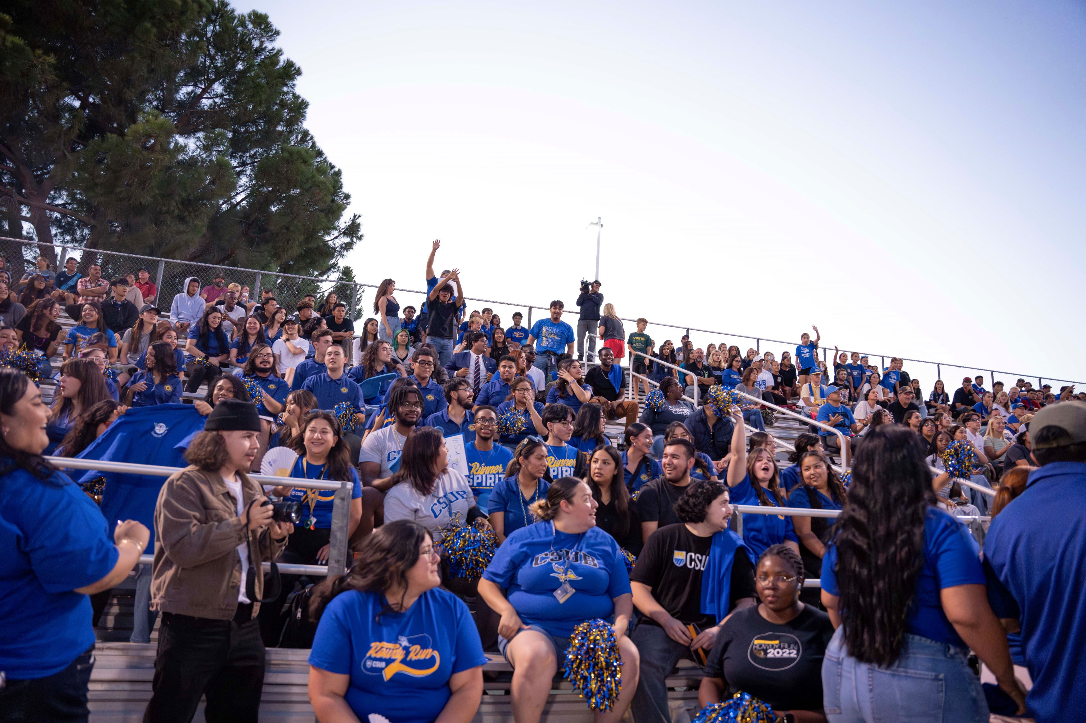 Group of CSUB students cheering from the bleachers at the 2024 Rowdy Run