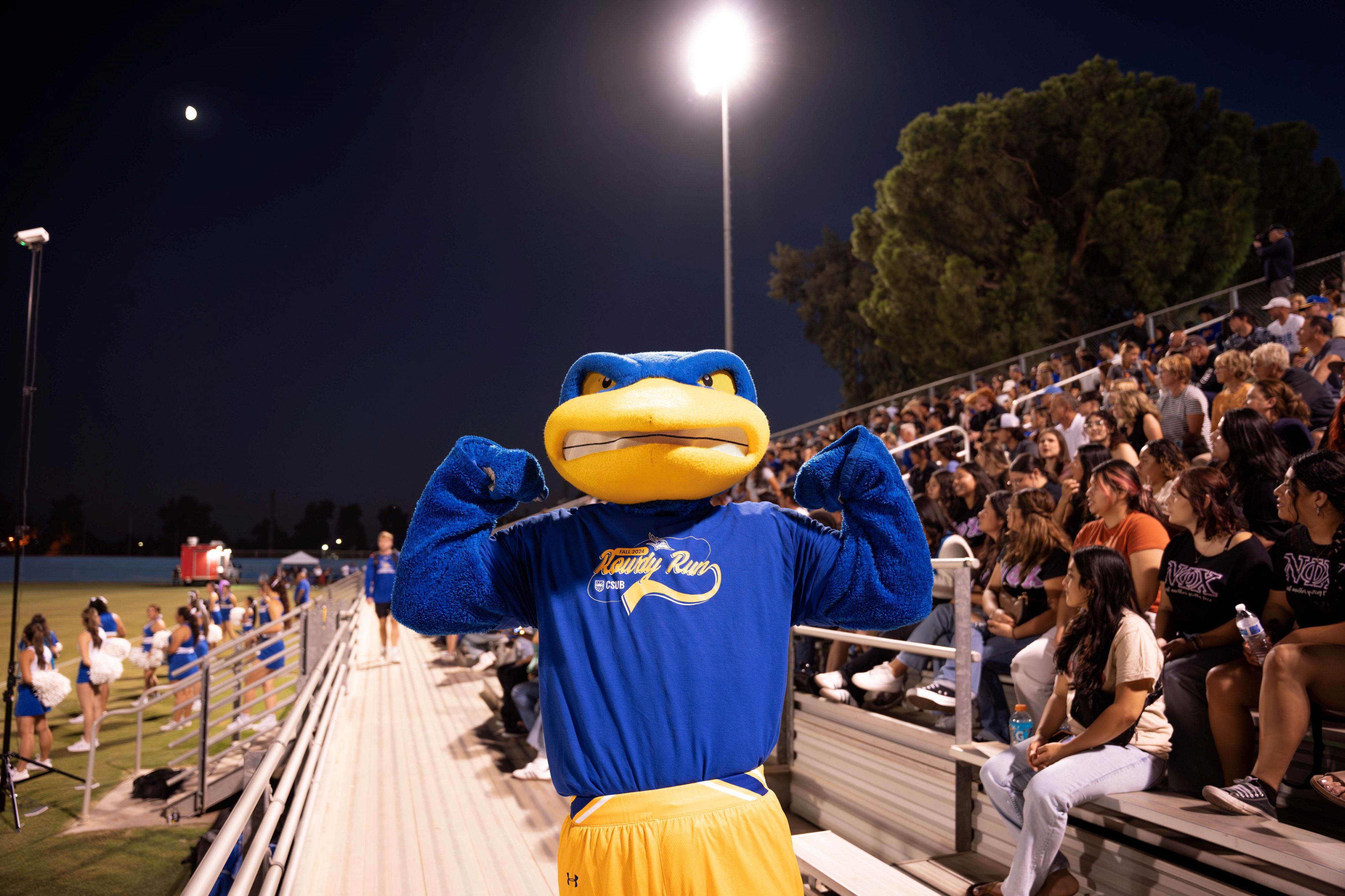 Rowdy flexing while wearing the 2024 Rowdy Run T-shirt