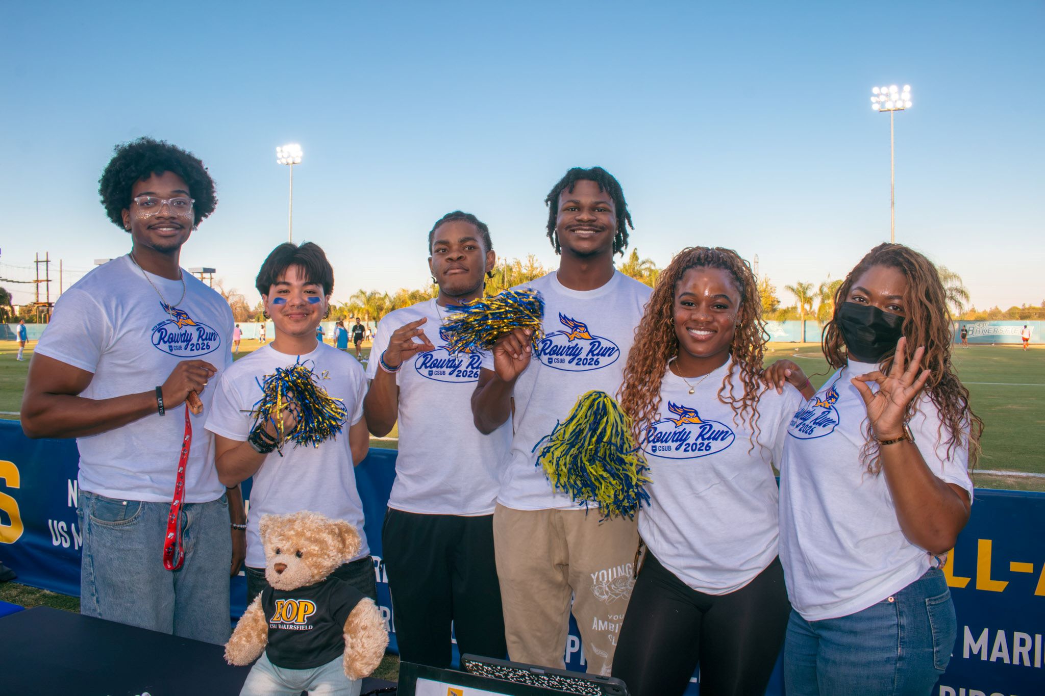 CSUB students and staff pose while wearing the white 2026 Rowdy Run T-shirt