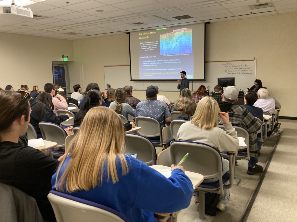Kluesner speaks in a full CSUB classroom