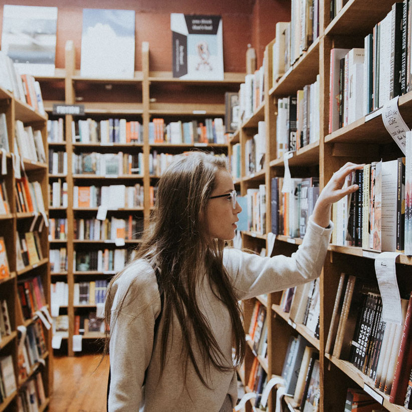 student in library