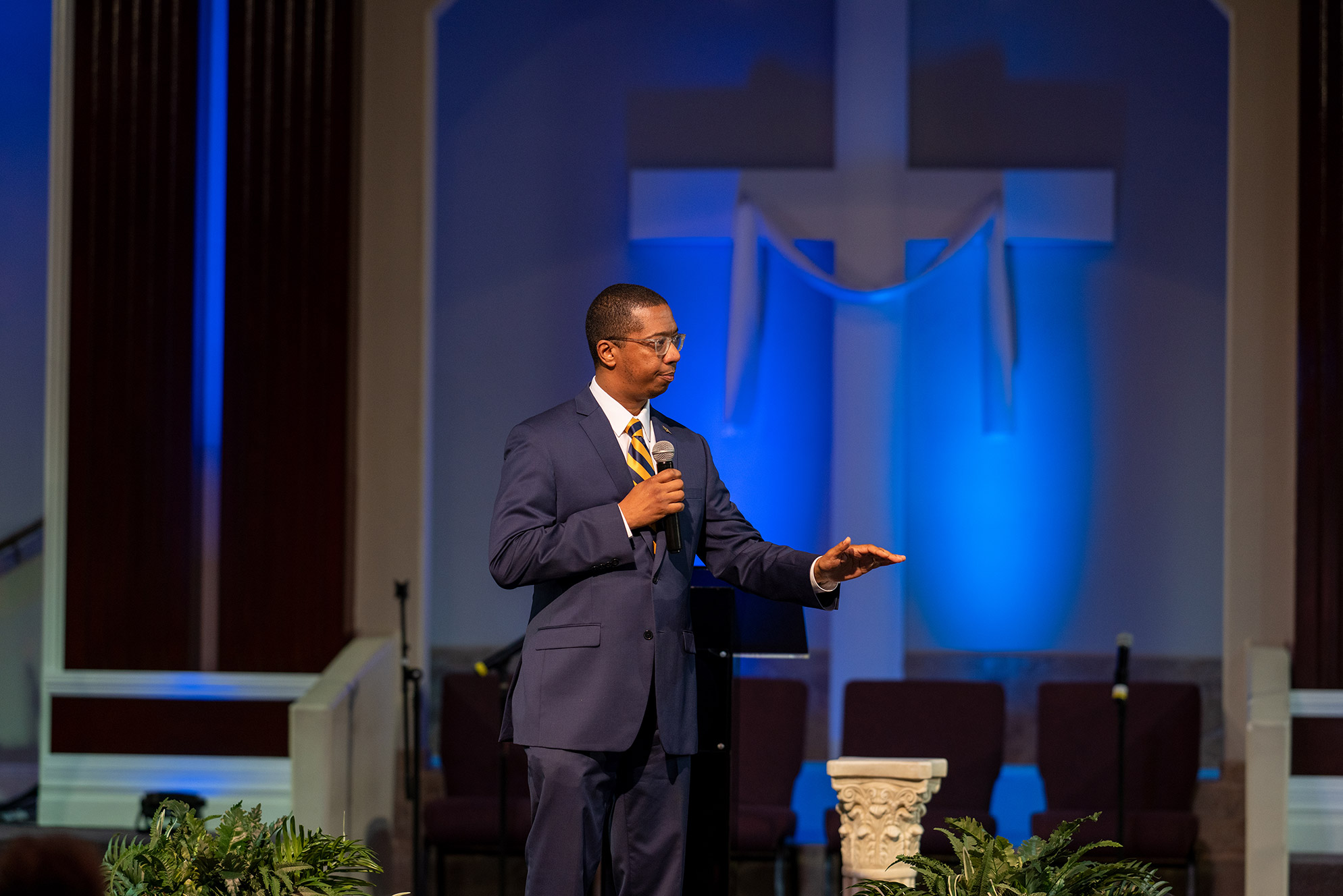 Pastor at church holding microphone