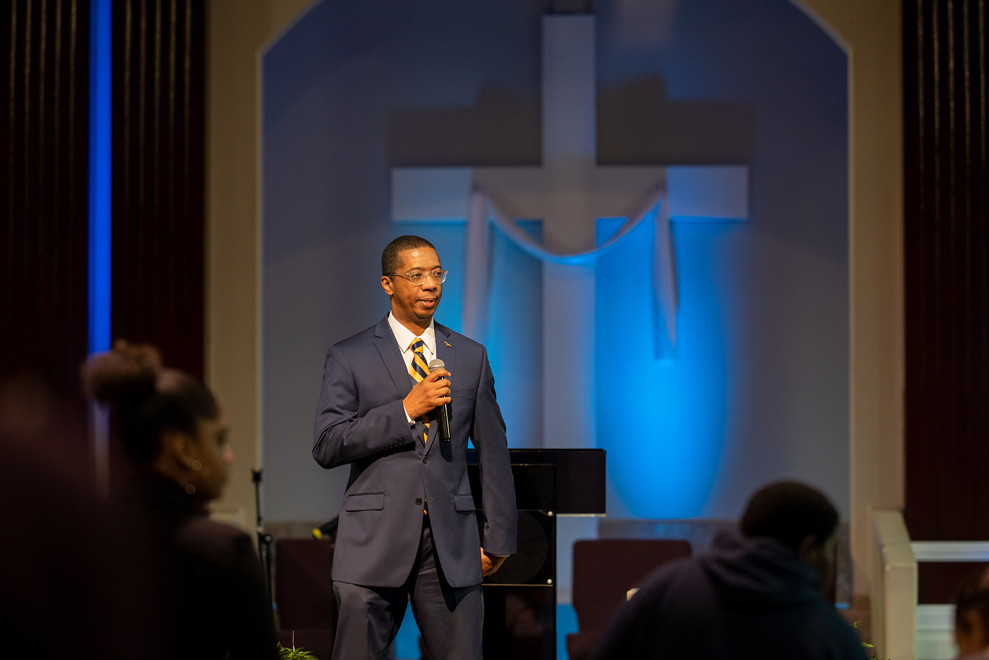 Pastor at church holding microphone