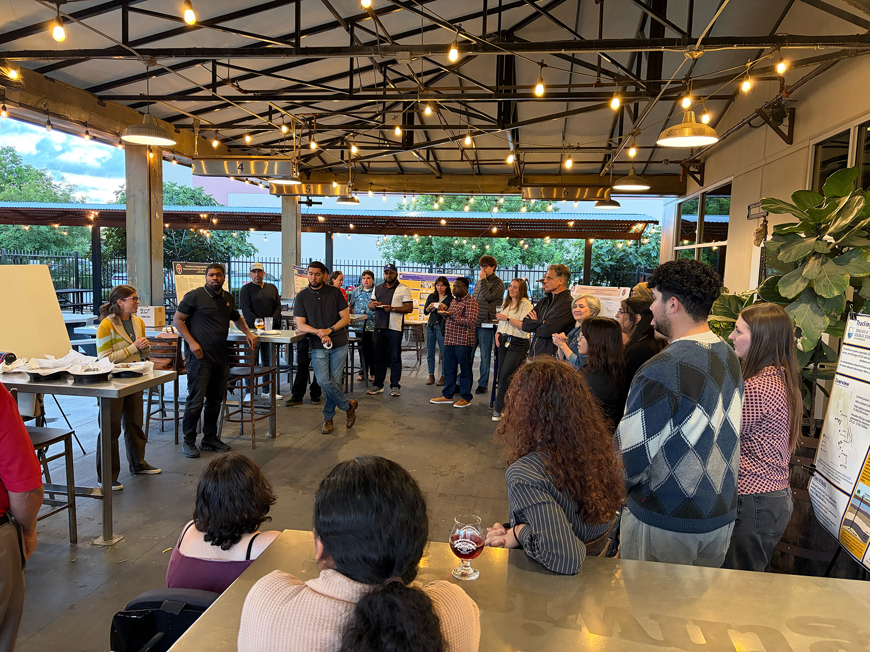 SJGS President and geology alumna Kari Hochstatter introduces the scholarship recipients