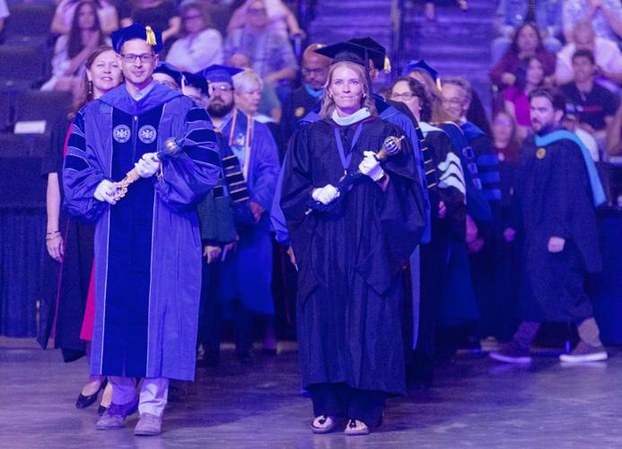 Dr. Herman leads the Spring 2026 commencement procession (much to the surprise of the graduating students)