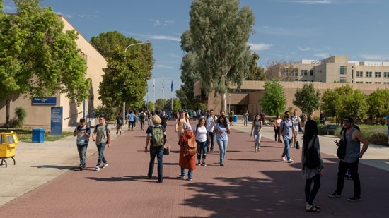 Students walking on the red brick road