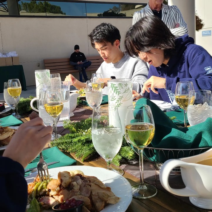 Two ALI students from Obirin University enjoy traditional Thanksgiving food