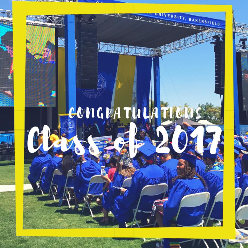 Graduates in blue caps and gowns sit at an outdoor commencement ceremony with 'Congratulations Class of 2017' overlaid