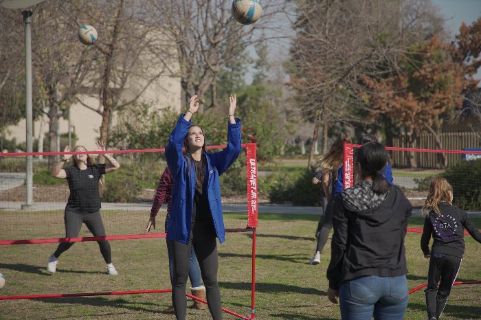 Students playing volleyball