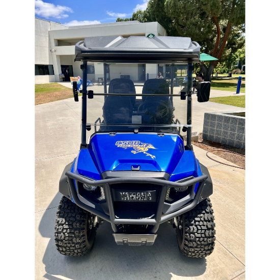 Blue golf cart with CSUB logo on the front