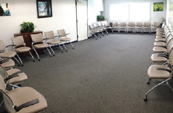 Student Union Blue Room in a conference layout in a circle layout with chairs around the perimeter, facing the center of the room.