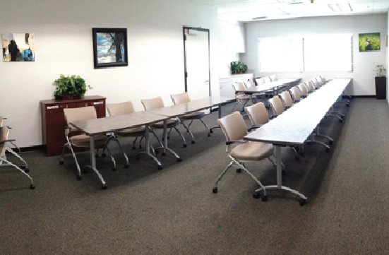 Student Union Blue Room in a classroom layout with tables and chairs facing forward