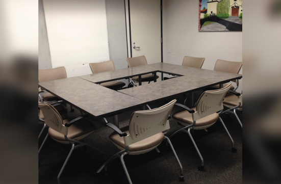 Student Union Green Room with tables arranged to form a hollow square layout.