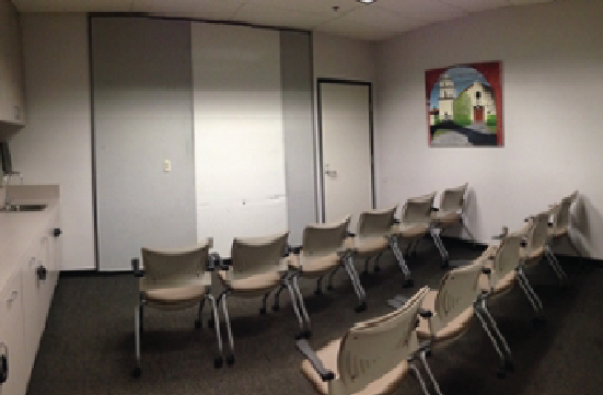 Student Union Green Room with chairs in rows facing forward.