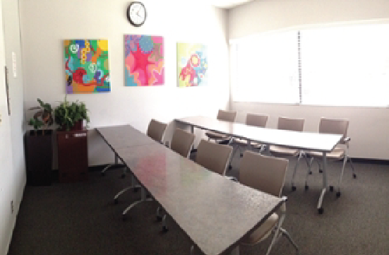 Student Union Yellow Room with tables and chairs facing forward