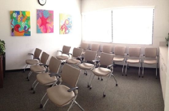 Student Union Yellow Room with chairs facing forward in a lecture layout.