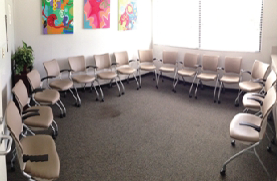 Student Union Yellow Room with chairs in a circle around the perimeter of the room, facing the center.