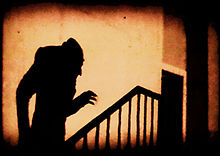 A vampire's shadow on a wall